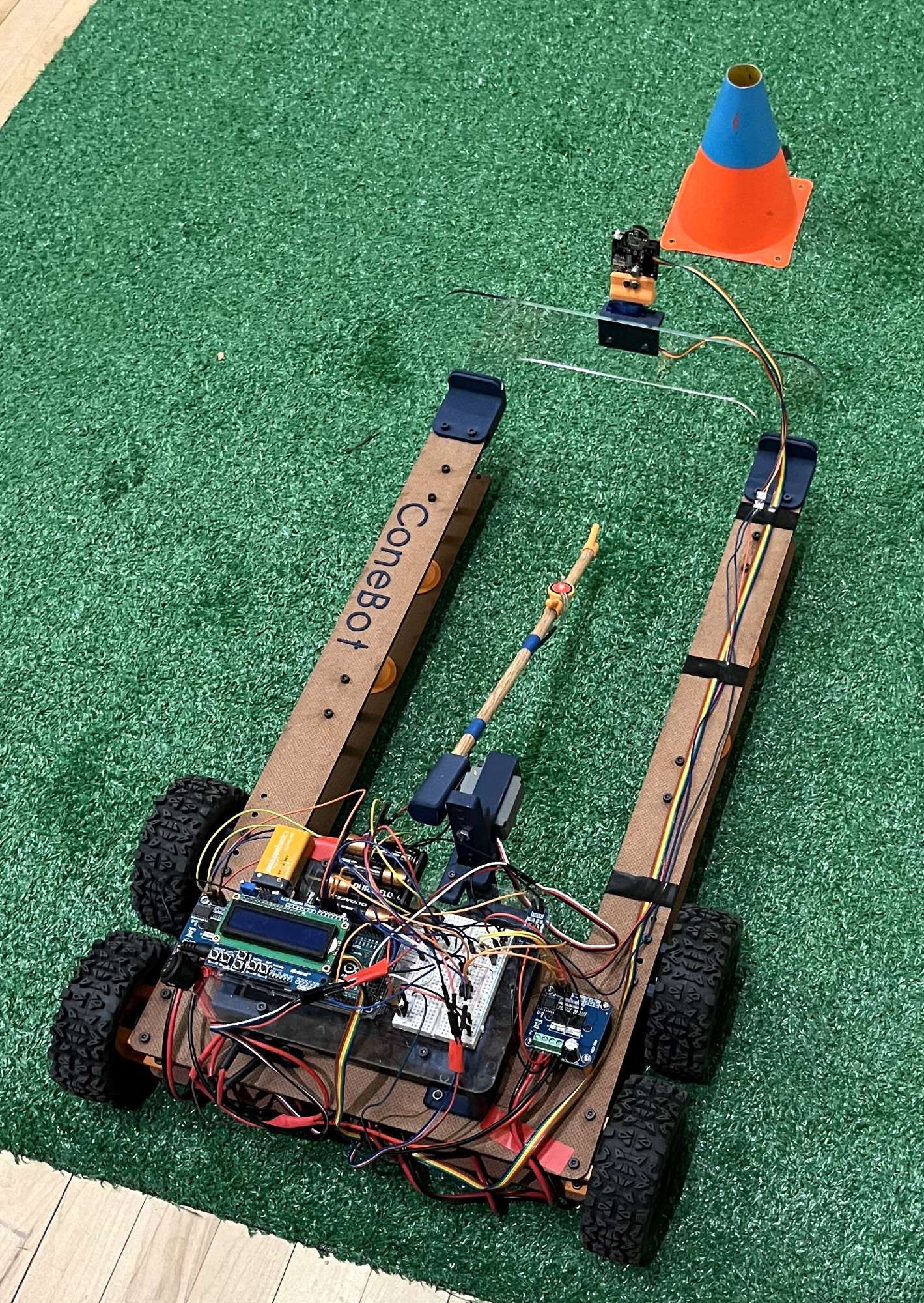 Final robot, built with 3D printed, laser cut, and off-the shelf components. Building the robot was a team effort.